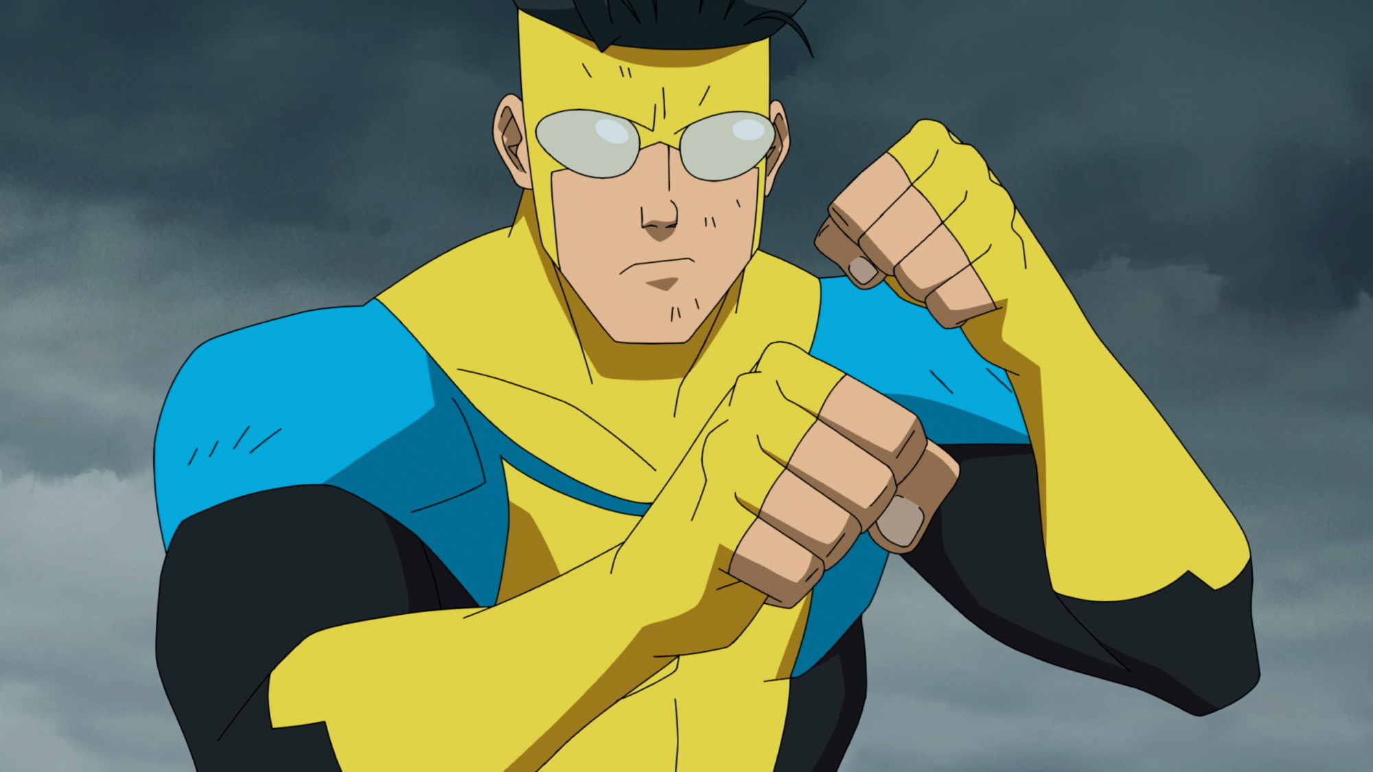 Mark Grayson wearing his Invincible costume and holding his fists up in 'Invincible' Season 1
