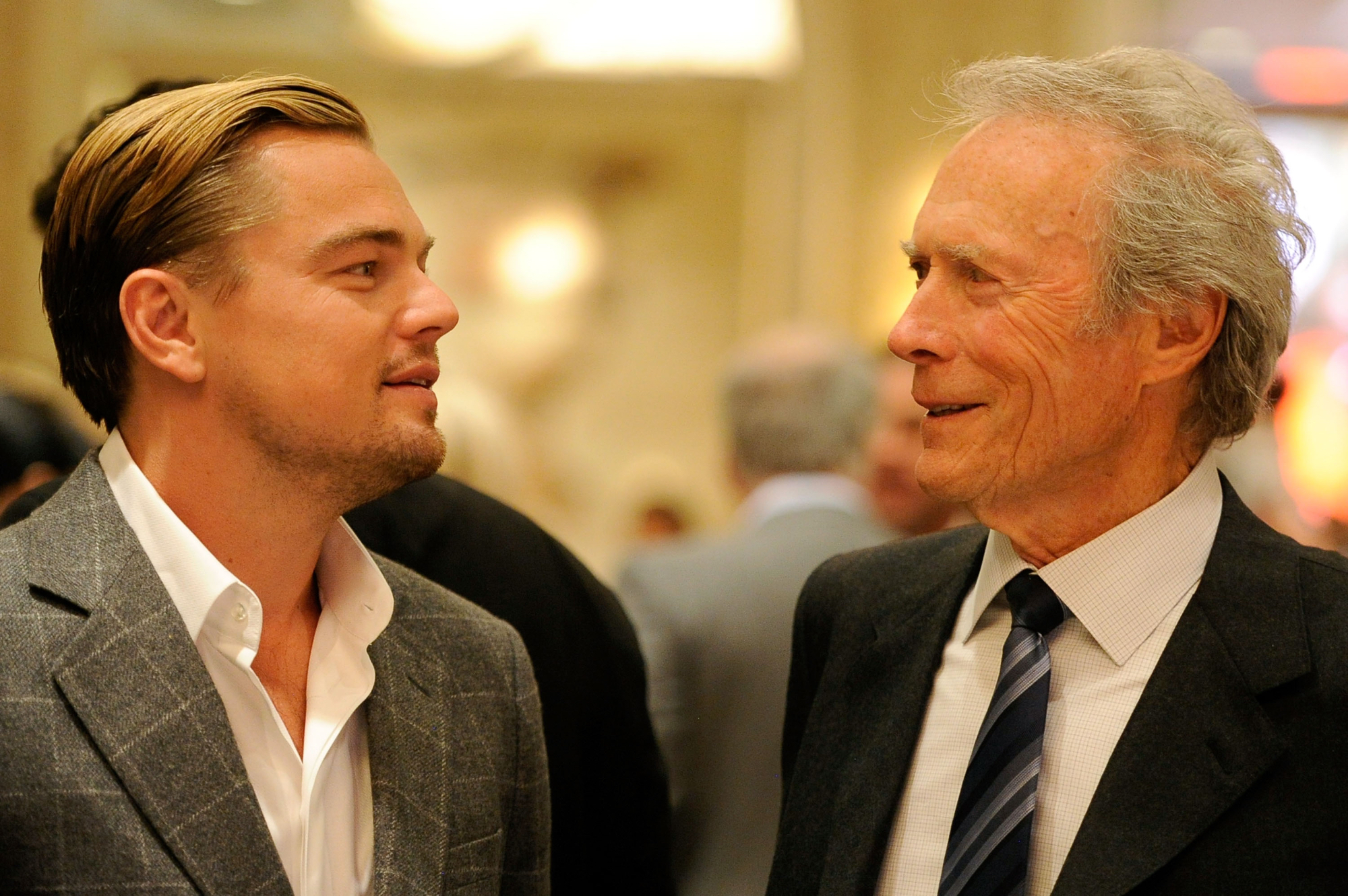 'J. Edgar' star Leonardo DiCaprio and Clint Eastwood facing each other in suits