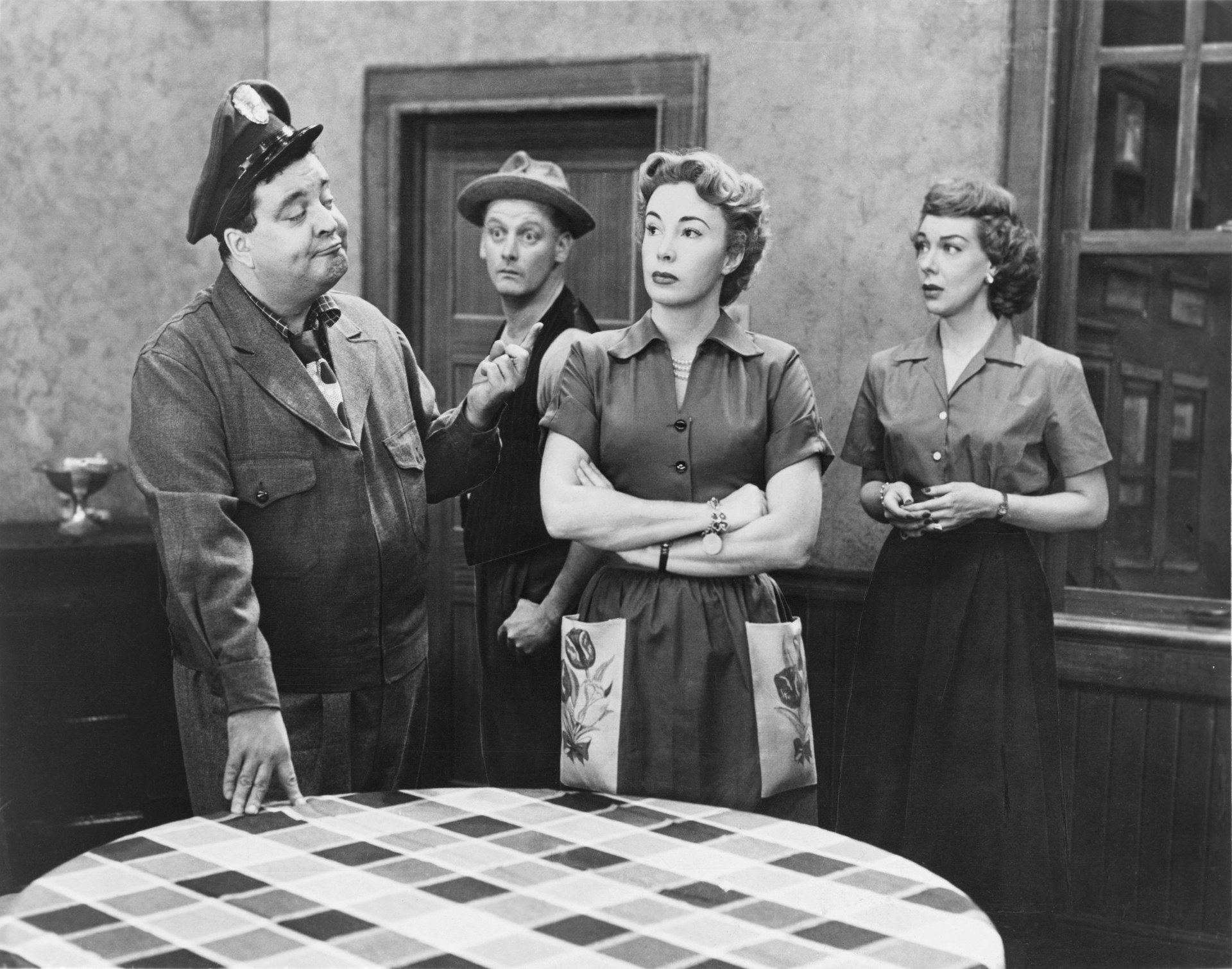 Jackie Gleason poses with the cast of 'The Honeymooners' in the kitchen. 