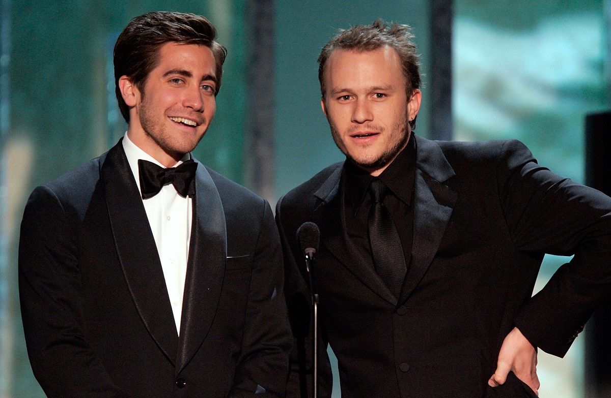 Jake Gyllenhaal and Heath Ledger smiling.