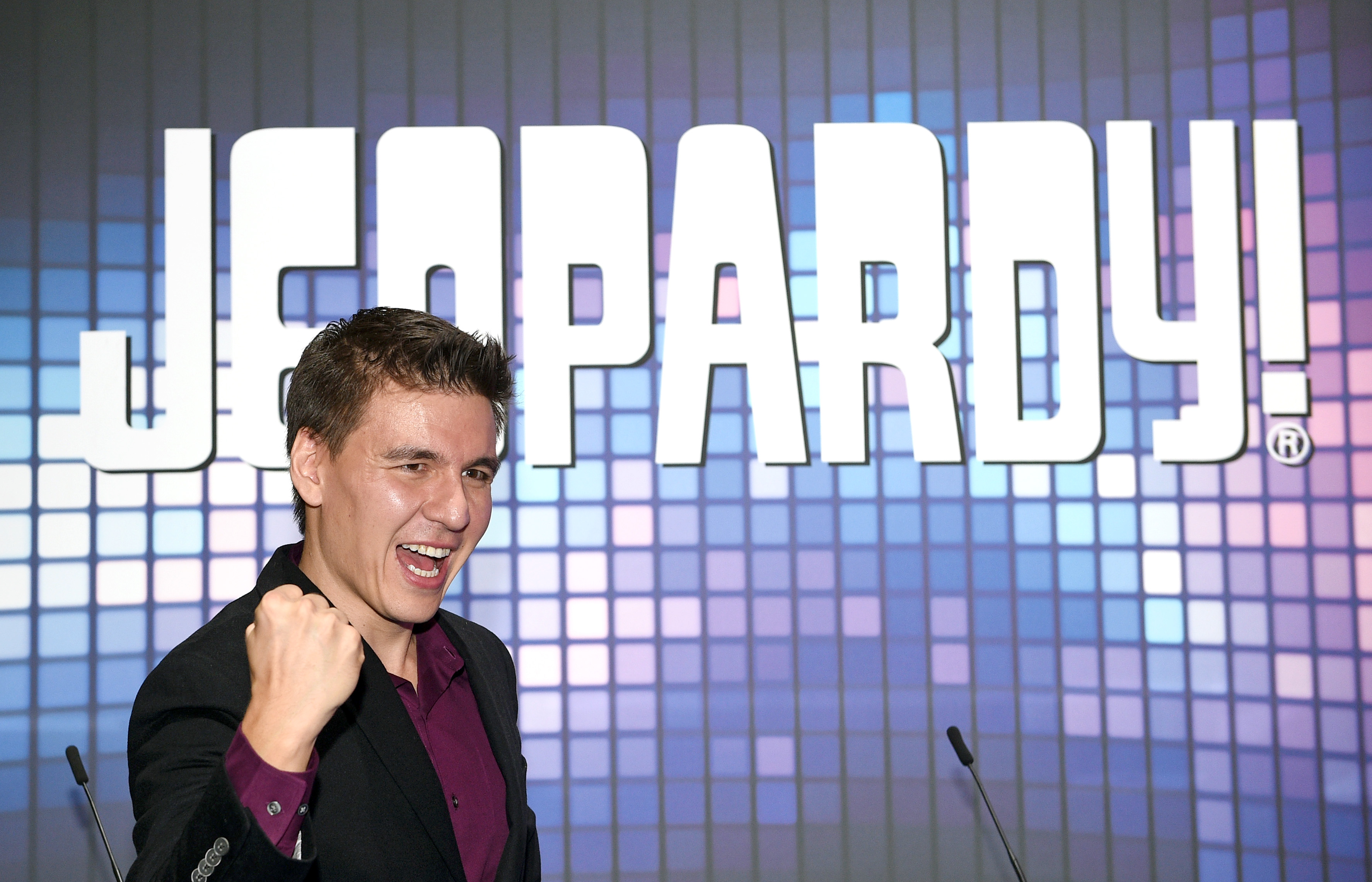 Professional sports gambler and former 'Jeopardy!' champion James Holzhauer poses at the IGT booth during the trade show debut of two 'Jeopardy!'-themed IGT slot machines during the Global Gaming Expo (G2E) at the Sands Expo and Convention Center