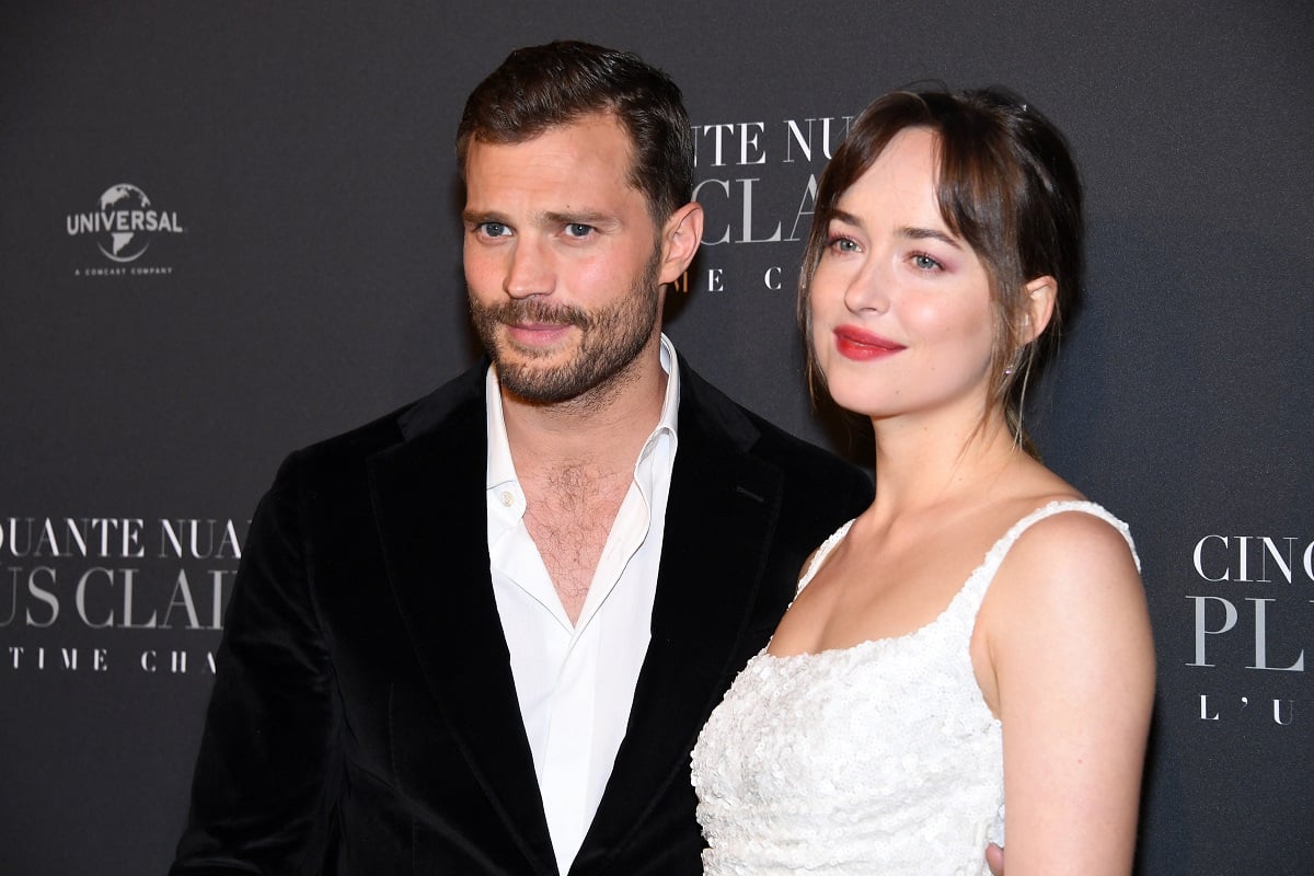 Jamie Dornan smiling with Dakota Johnson.