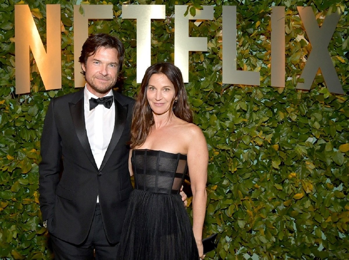 Jason Bateman and his wife pose for photo as they arrive at the Netflix Golden Globes afterparty