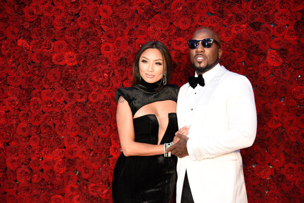 Jeannie Mai and Jeezy on a rose background