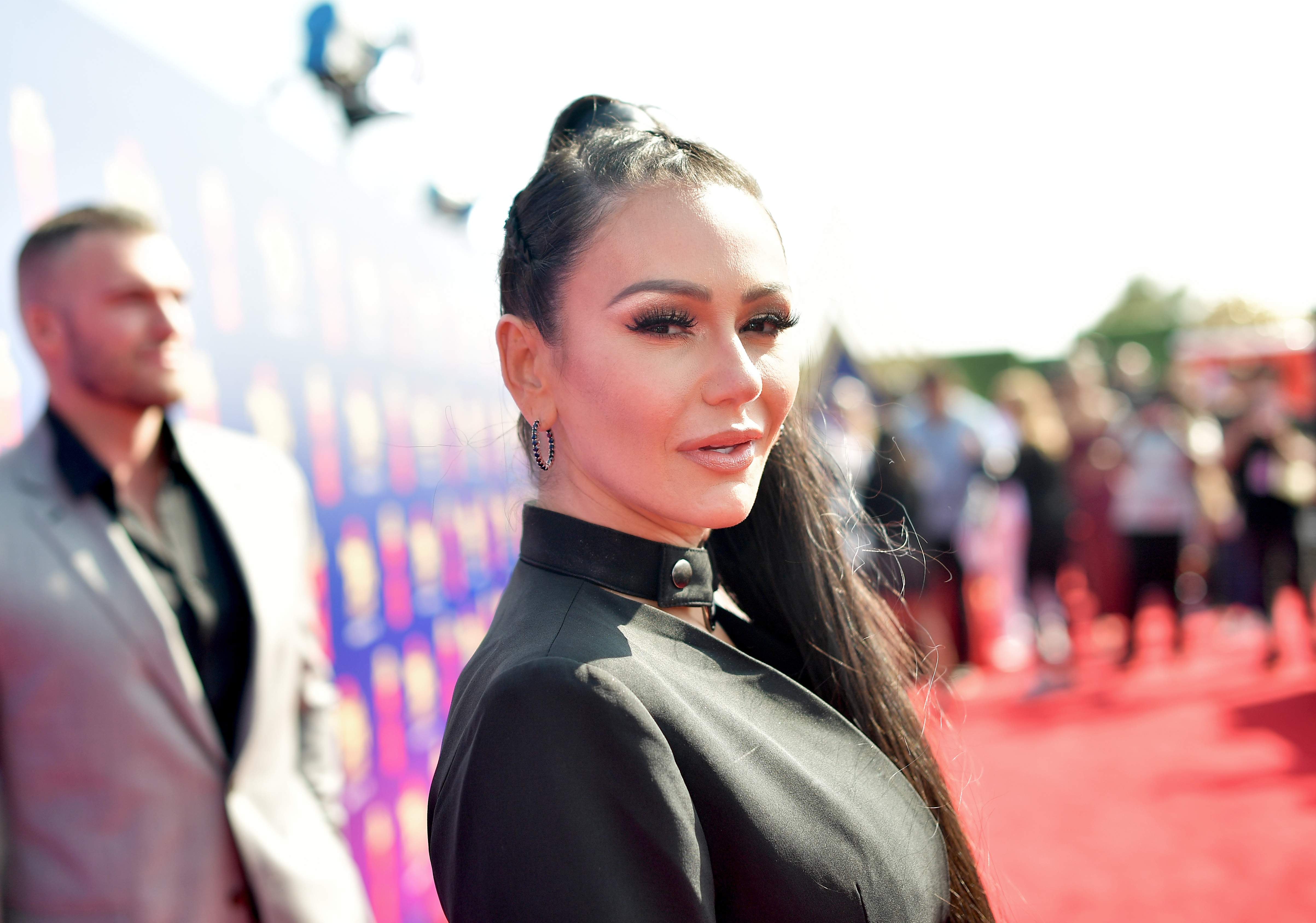 'Jersey Shore' star Jenni 'JWoww' Farley turns her head to look at the camera at an event