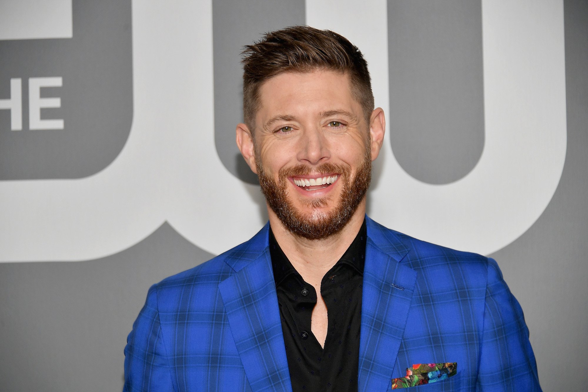 Jensen Ackles smiles at the CW upfronts before the 'Supernatural' final season