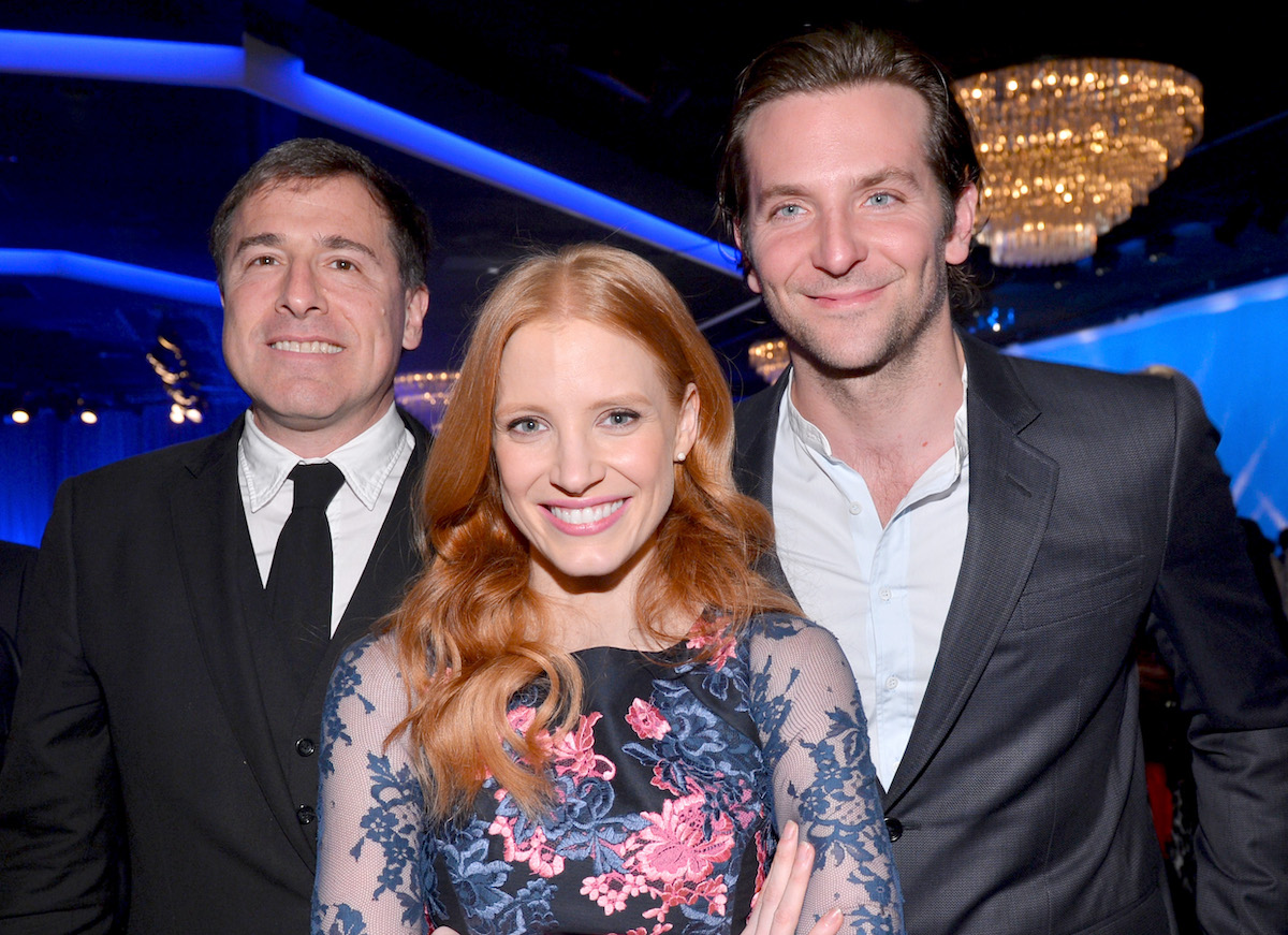 Jessica Chastain and Bradley Cooper pose with director David O. Russell in 2013