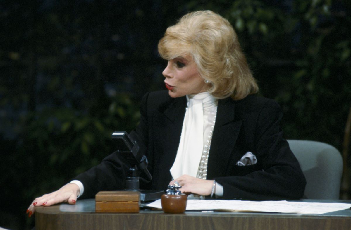 Joan Rivers as a guest host on 'The Tonight Show' in a white shirt and black jacket