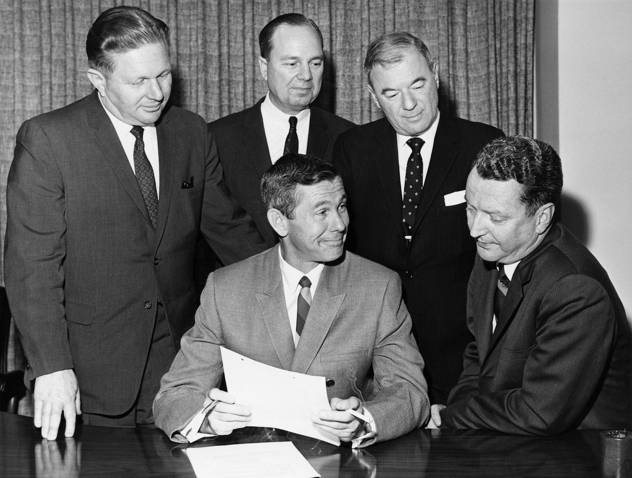 (l-r) NBC's senior vice president for programming and talent Mort Werner, host Johnny Carson, NBC Chairman Walter D. Scott, president of NBC Television Don Durgin, NBC president Julian Goodman during a signing of Johny Carson's Tonight Show contract in 1966