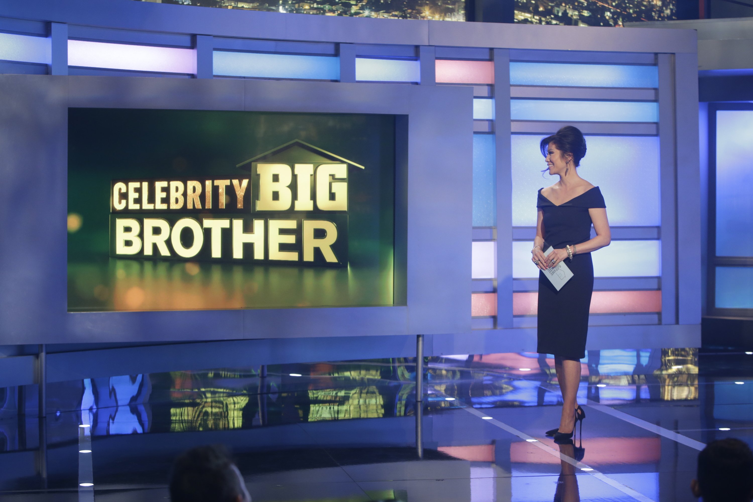 Julie Chen Moonves standing onstage in a black dress during 'Celebrity Big Brother'