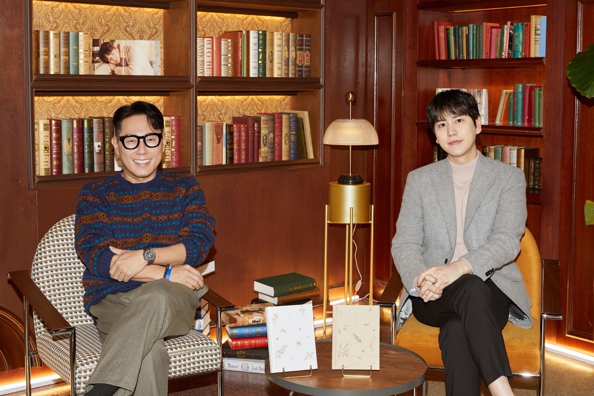 Yoon Jong-shin and KYUHYUN sit during KYUHYUN's press conference for 'Love Story'