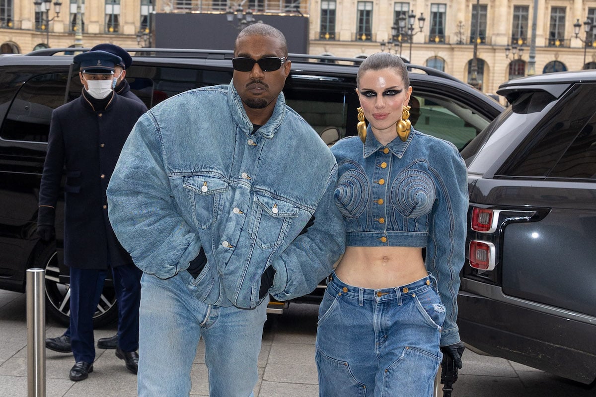 Kanye West and Julia Fox wear matching denim outfits to a fashion show.