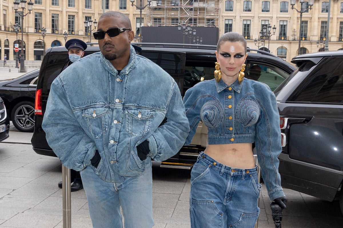 Kanye West and Julia Fox wear matching denim outfits to an event.