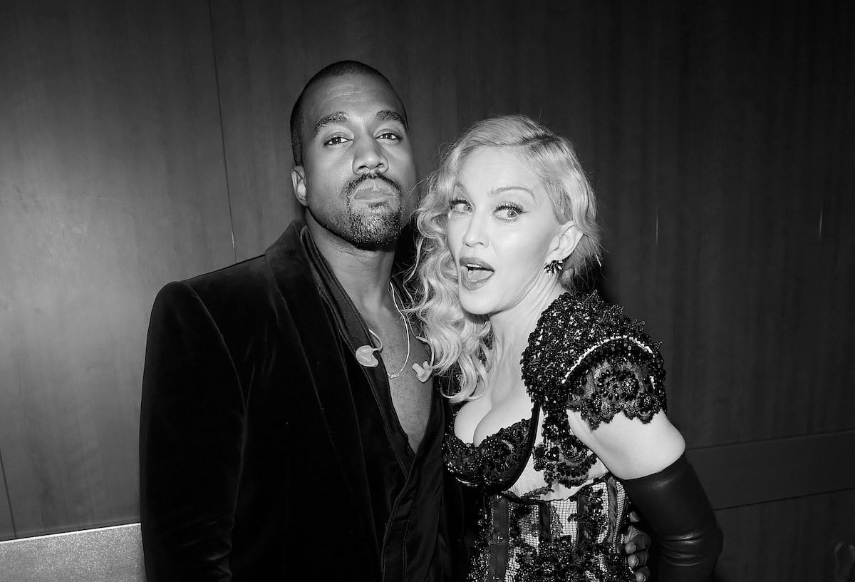 Kanye West and Madonna pose together at an event.