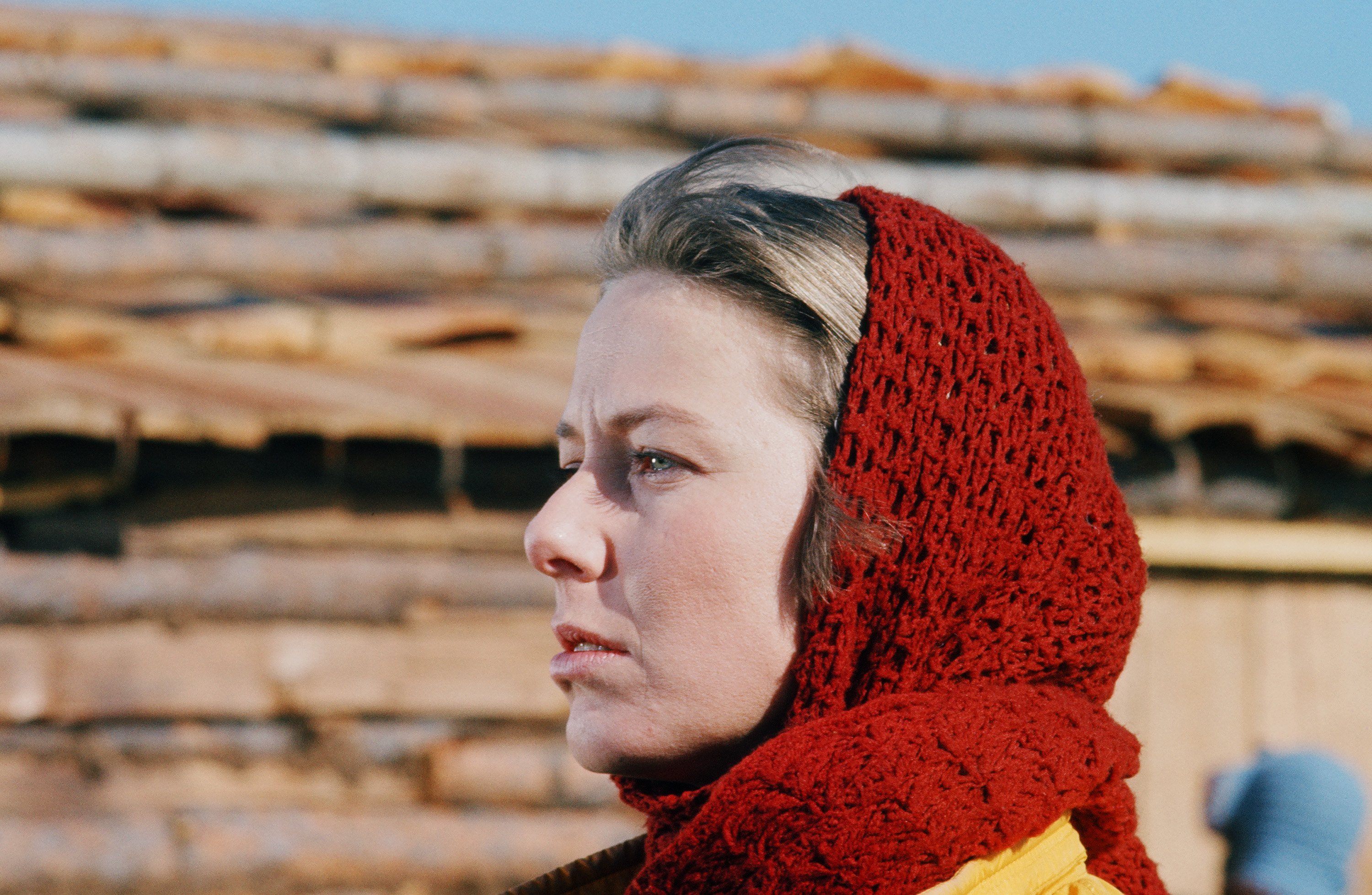 Karen Grassle stands on the set of 'Little House on the Prairie' with a red scarf around her head.