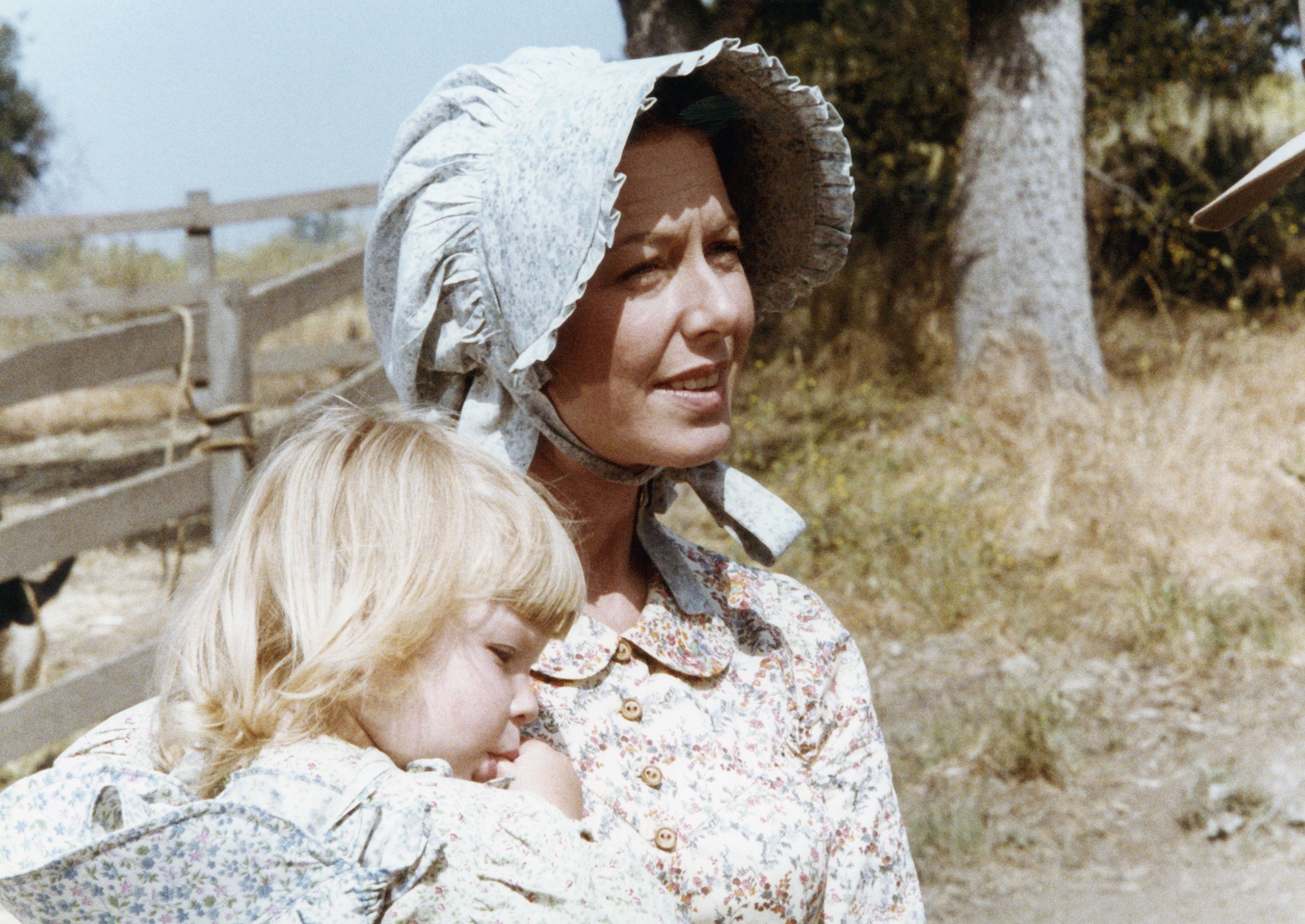 Karen Grassle holds the actor who plays Grace Ingalls (Brenda and Wendi Turnbaugh) on the set of 'Little House on the Prairie'