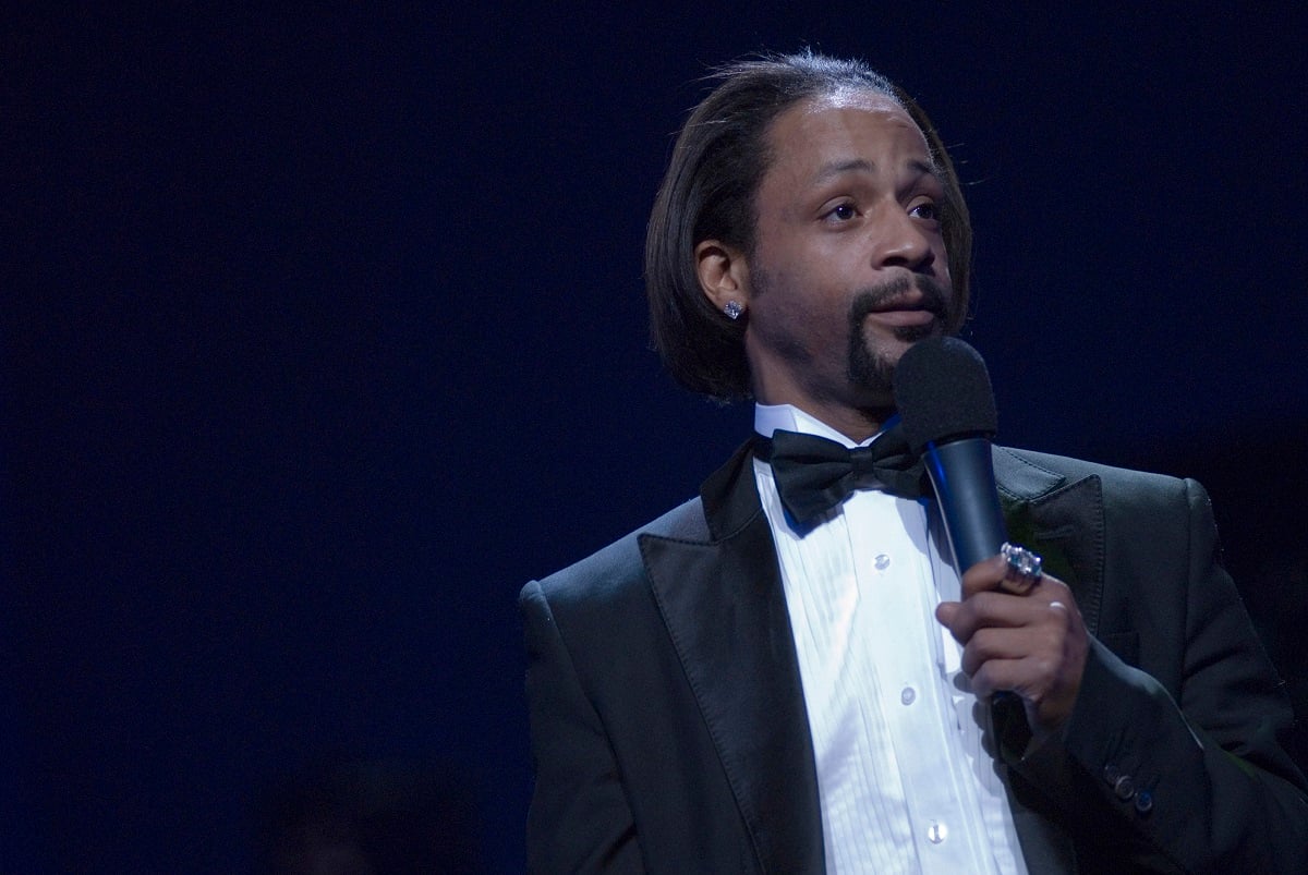 Katt Williams holding a microphone.