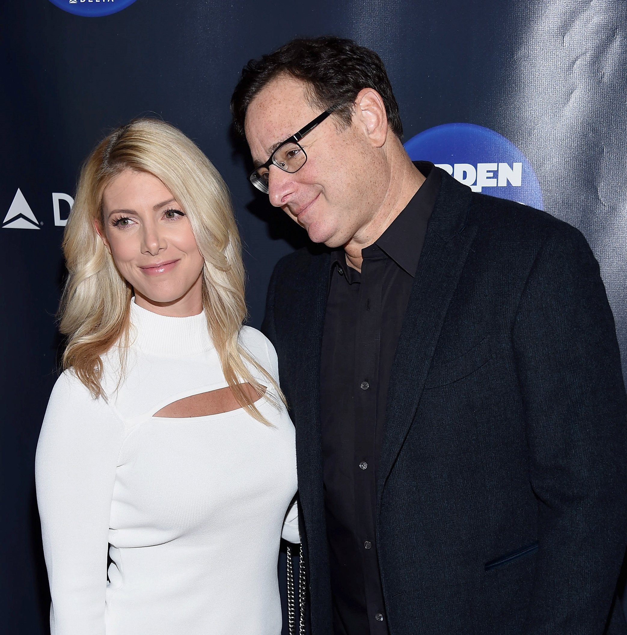 Kelly Rizzo and Bob Saget have their photo taken on the red carpet at the Garden Of Laughs Comedy Benefit
