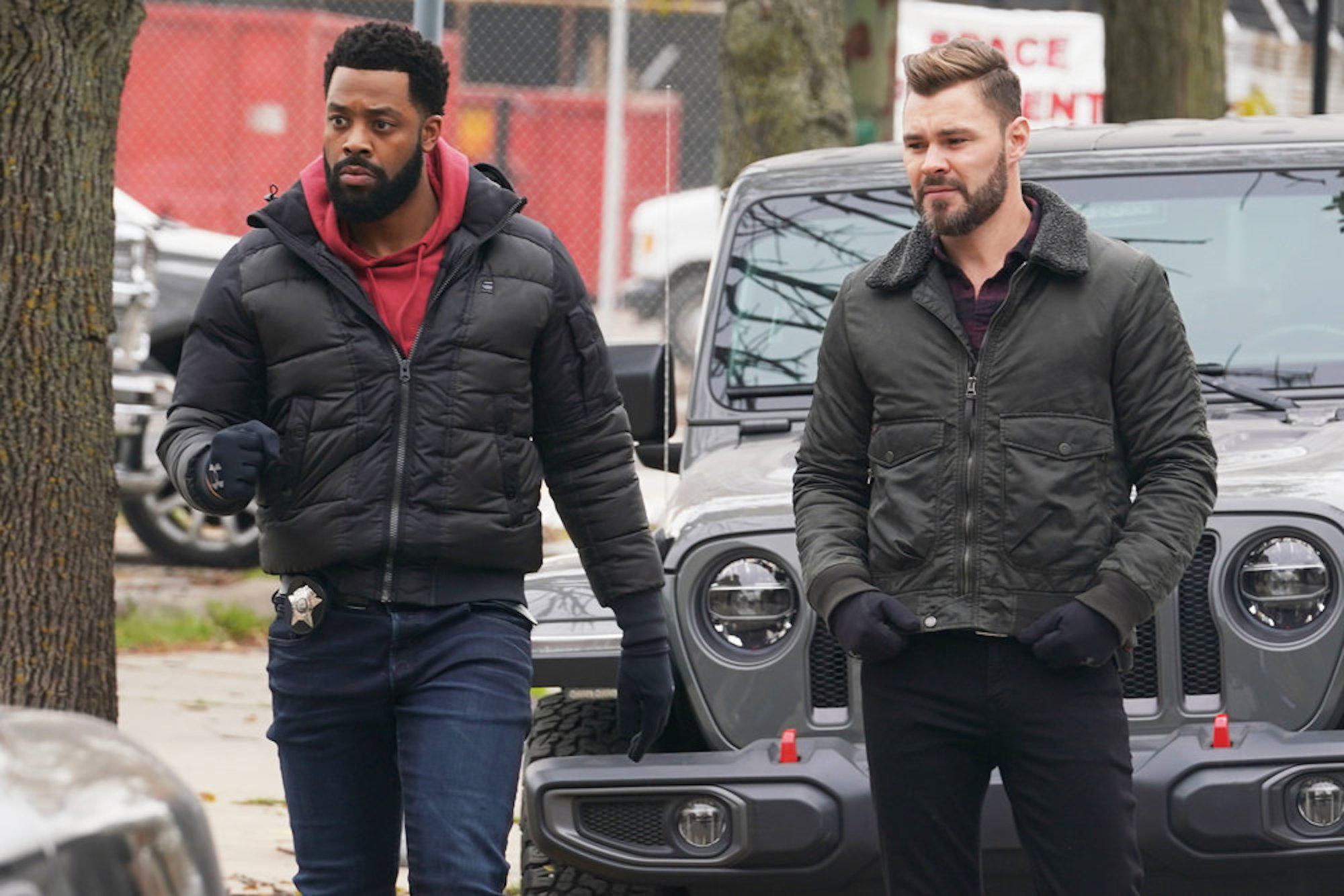 Kevin Atwater and Adam Ruzek standing next to each other in 'Chicago P.D.' Season 9 Episode 10