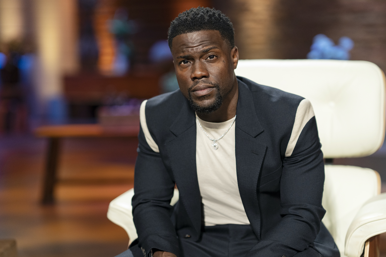 Kevin Hart sits in a chair and poses on 'Shark Tank'