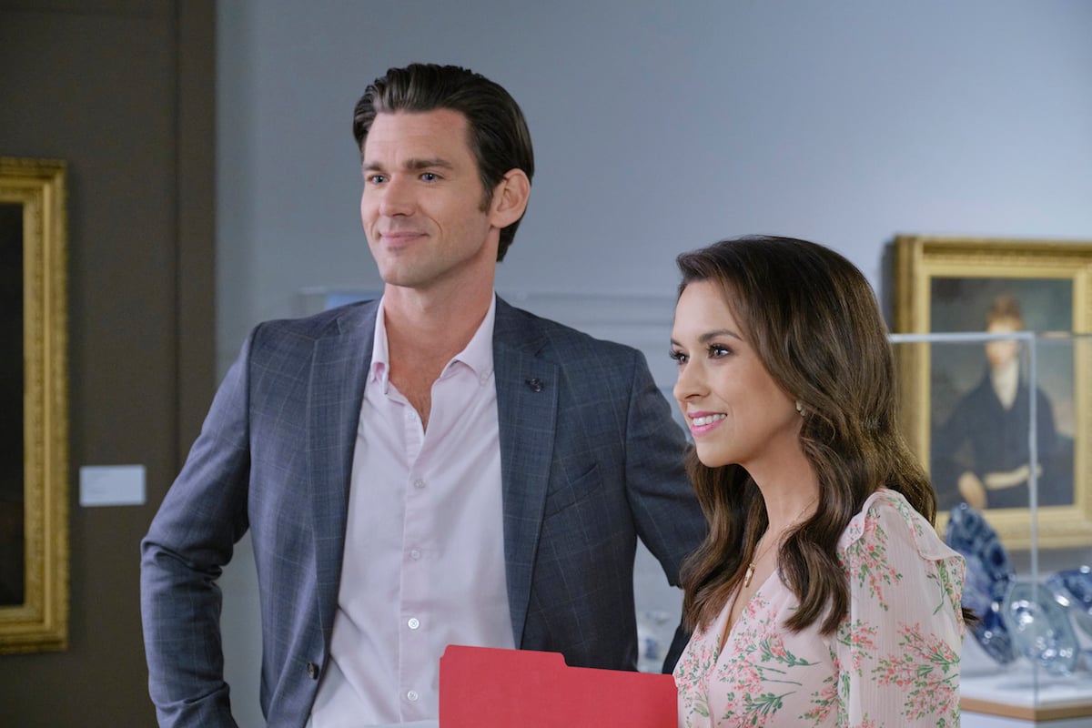 Kevin McGarry and Lacey Chabert, both smiling, in the Hallmark movie 'The Wedding Veil'