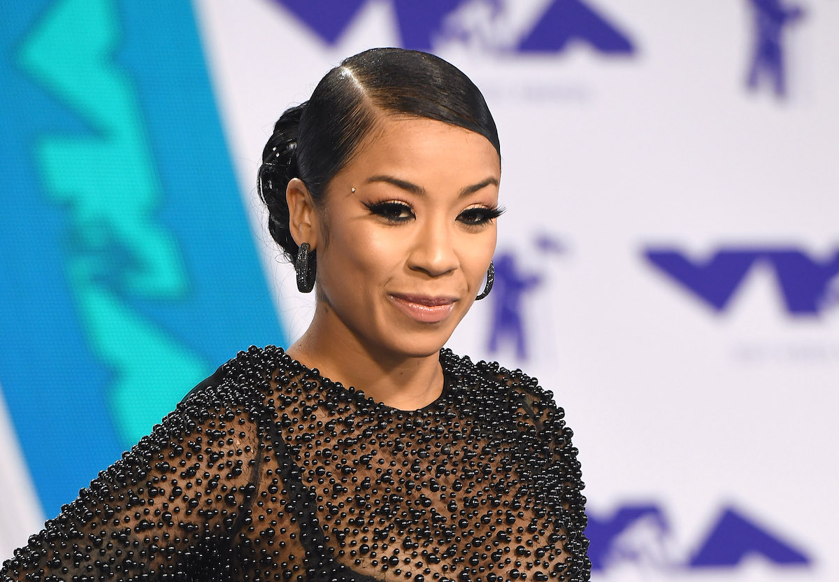 Keyshia Cole smiling wearing black