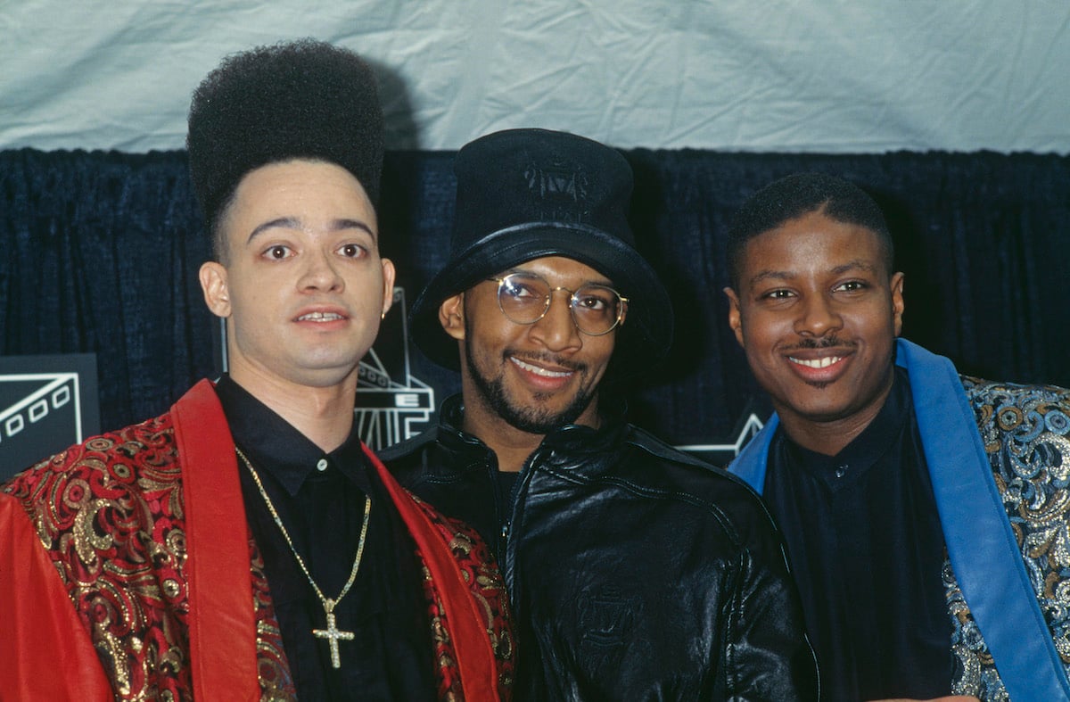 Christopher 'Kid' Reid, Mark ‘DJ Wiz’ Eastmond, and Christopher 'Play' Martin pose on the red carpet