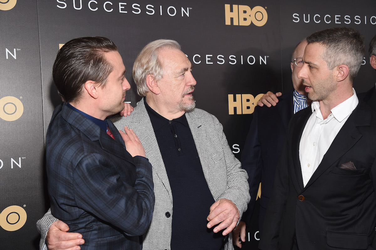Kieran Culkin, Brian Cox and Jeremy Strong speak in front of cameras at the 'Succession' premiere in 2018