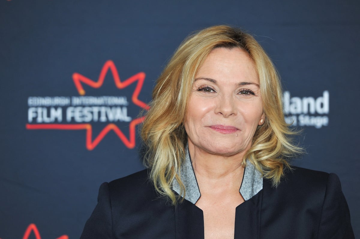 Kim Cattrall smiles at an event.