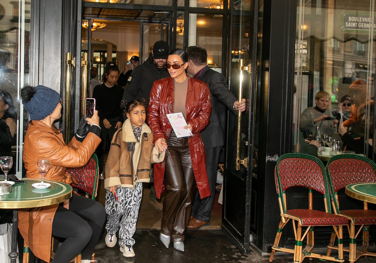 (LR) North West and Kim Kardashian West leaving a cafe in Paris, France