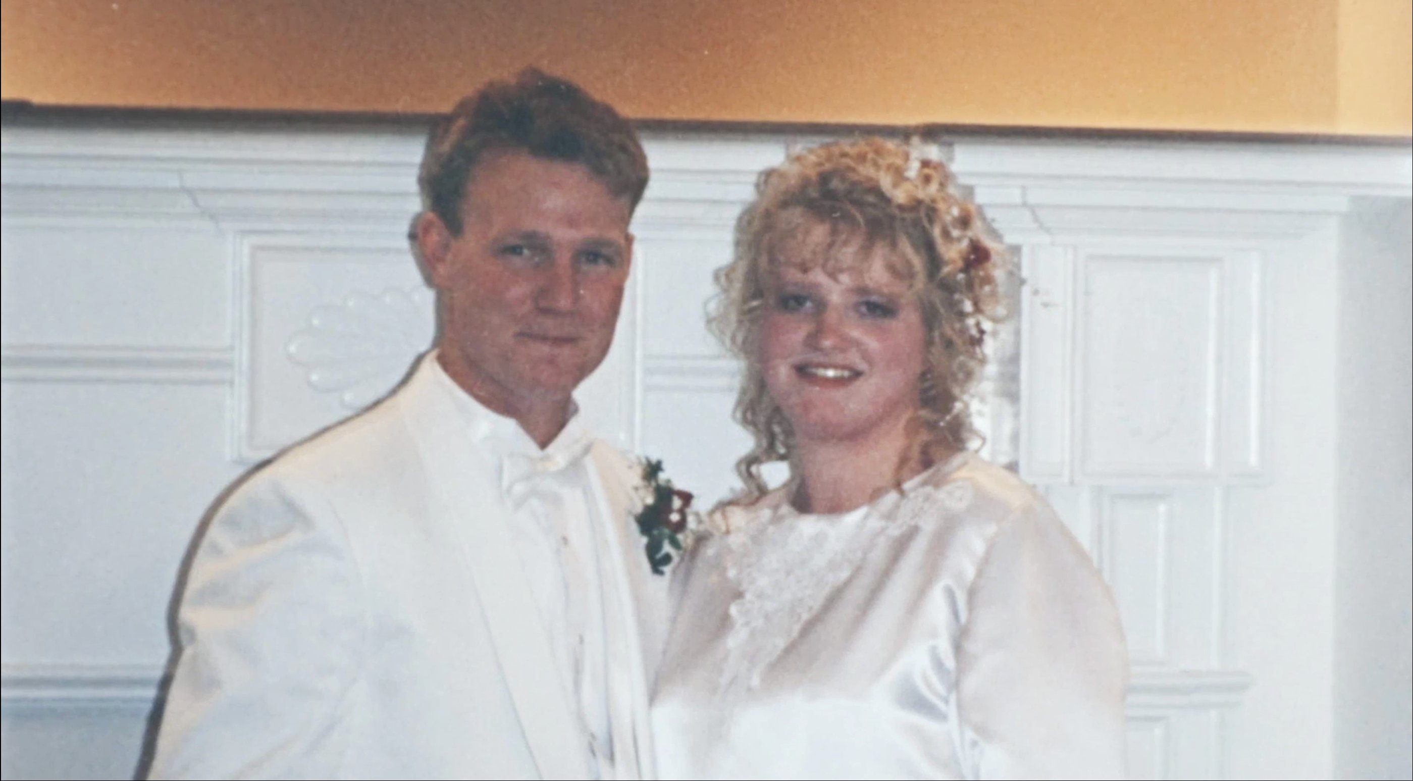 'Sister Wives' stars, Kody Brown wearing a tux and Christine Brown wearing a wedding dress on their wedding day.