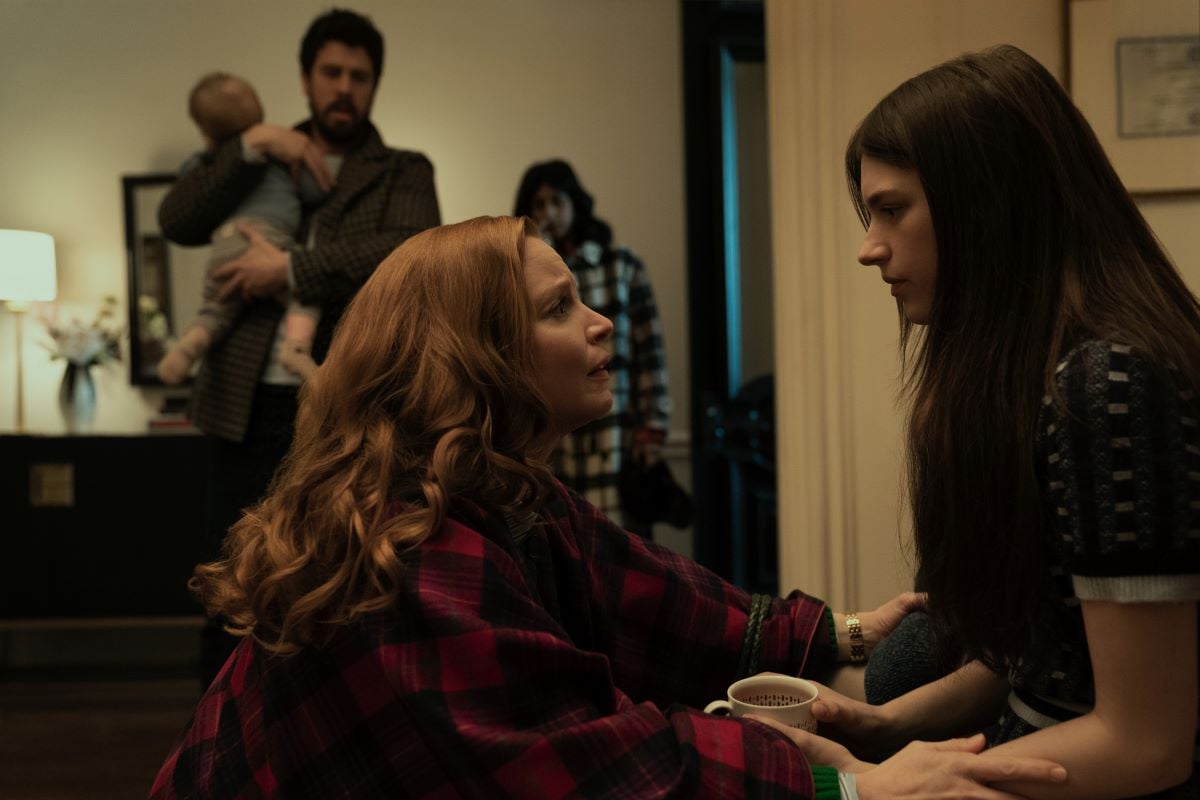 Lauren Ambrose kneels in front of Nell Tiger Free in 'Servant'