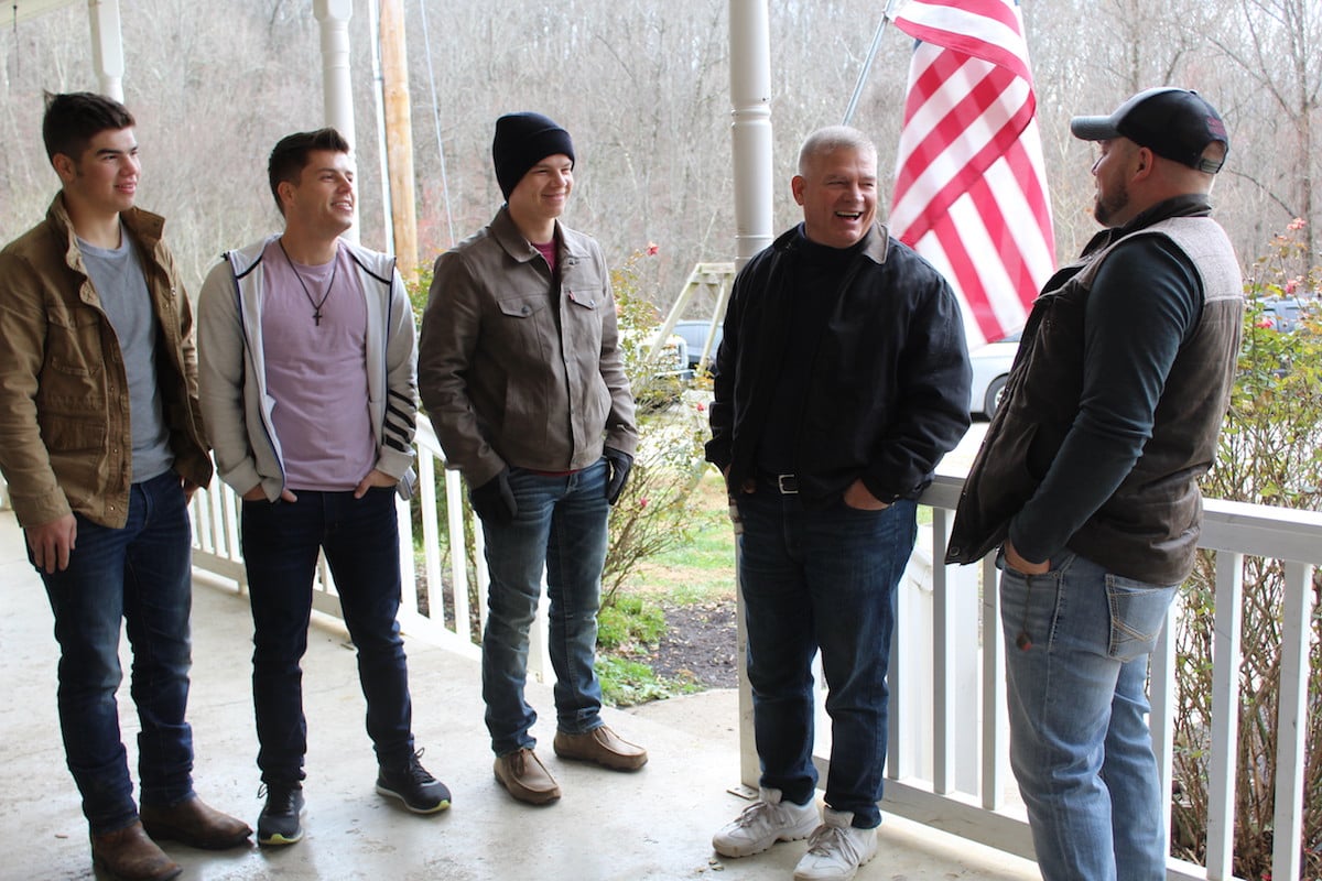 Male members of the Bates family from 'Bringing Up Bates' standing on a porch