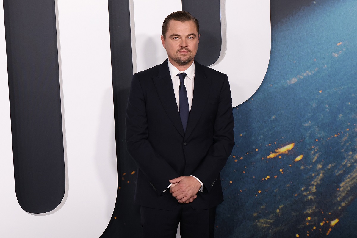 Leonardo DiCaprio posing in a suit.