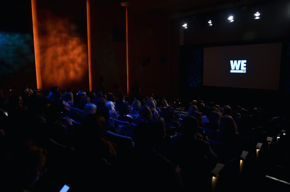 Photo of a movie theater with the WE tv logo