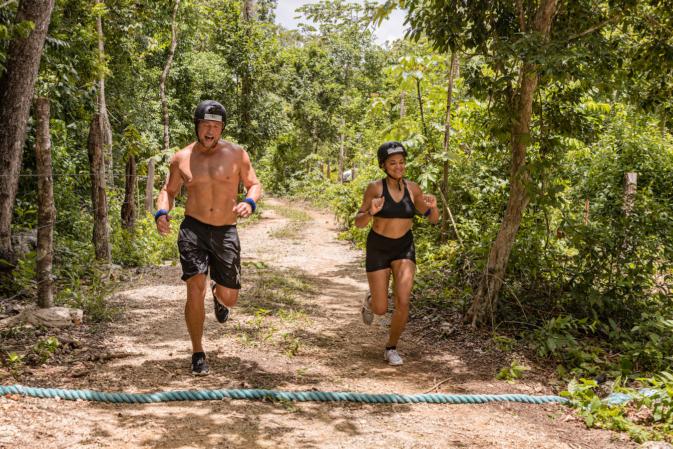 MJ and Jonna running together in the jungle in 'The Challenge: All Stars' Season 2
