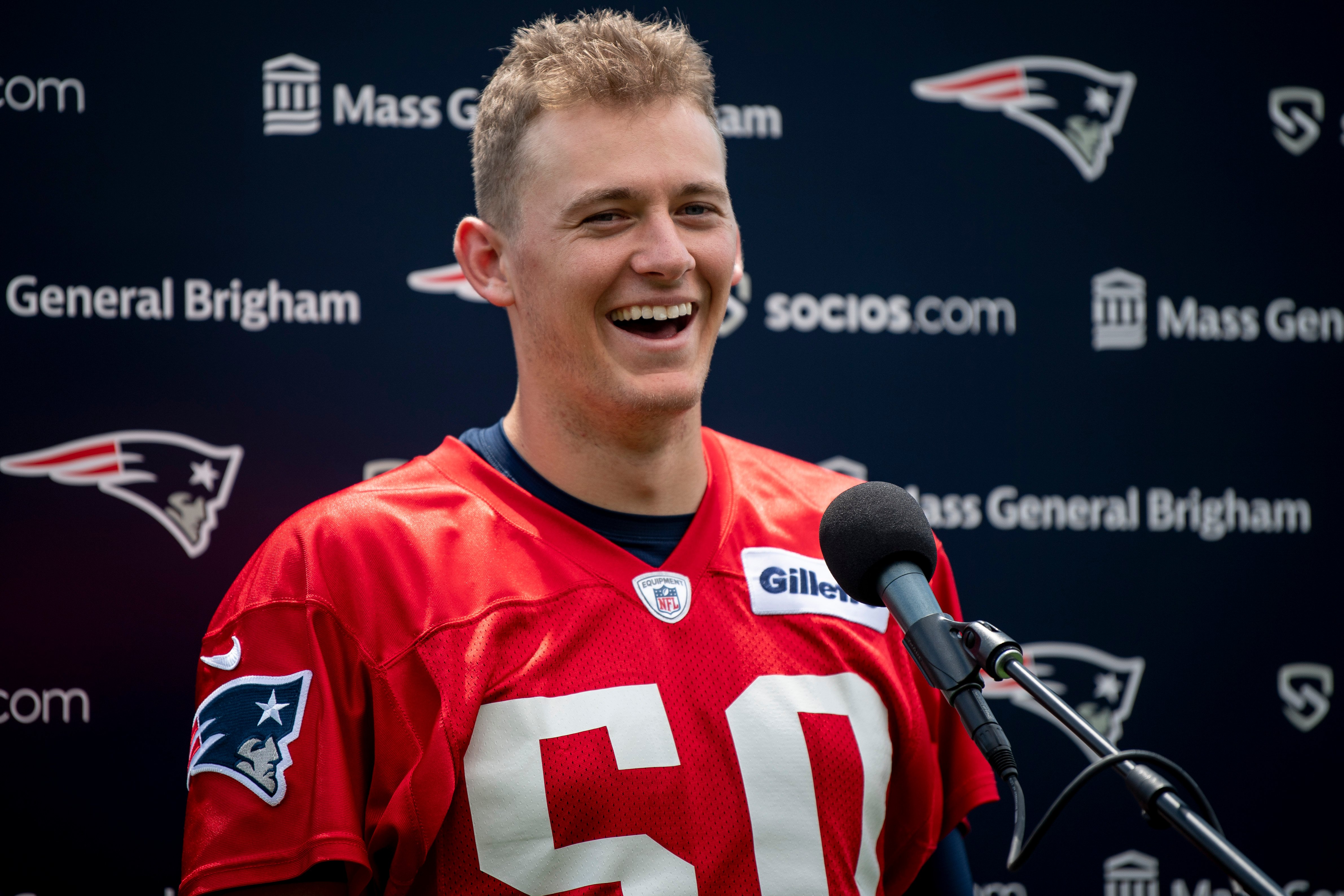 Mac Jones laughing as he addresses media at Gillette Stadium