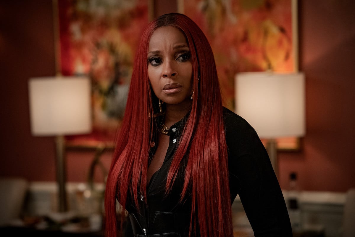 Mary J. Blige as Monet Tejada wearing a black shirt and red hair in 'Power Book II: Ghost'