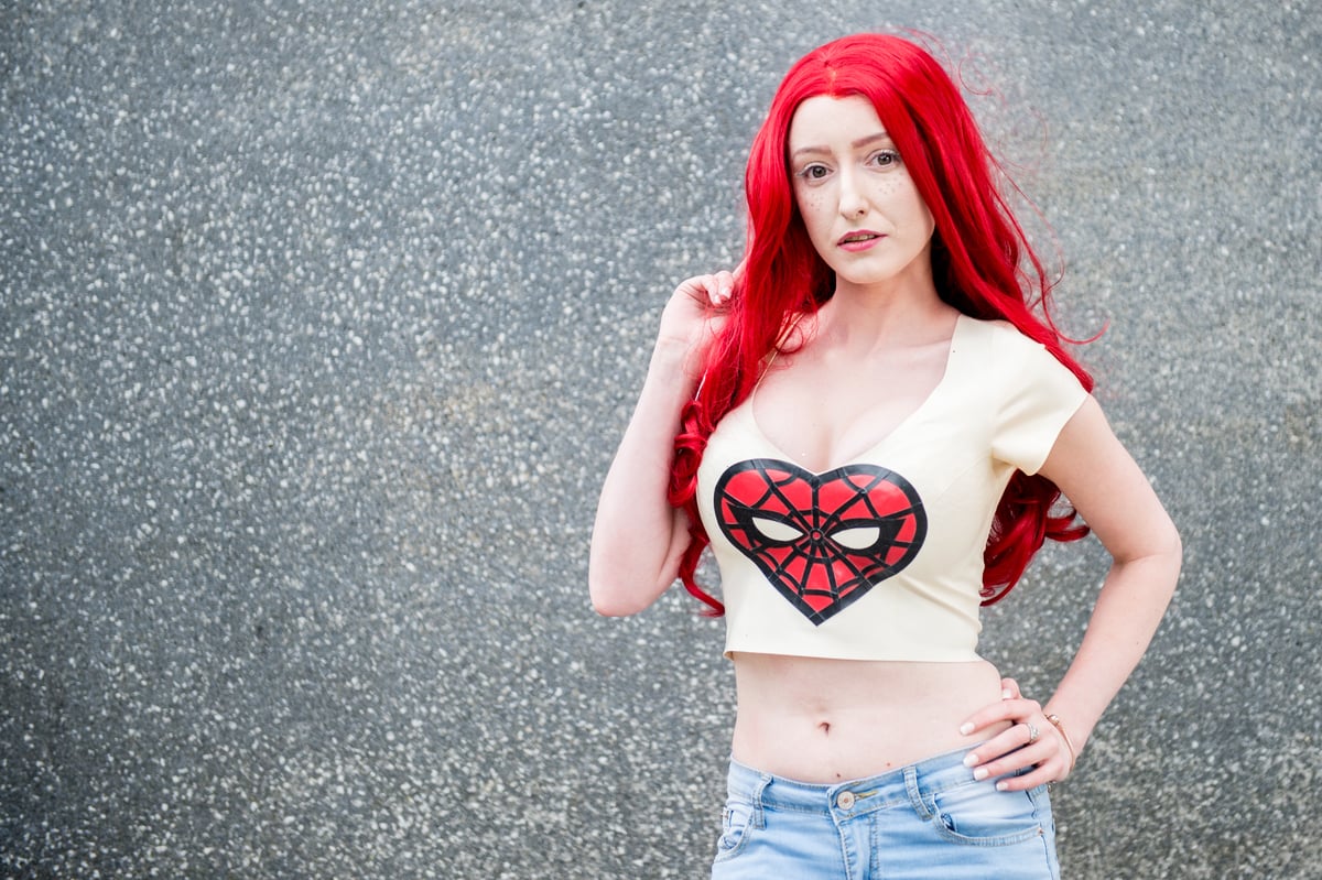 A cosplayer as Mary Jane Watson from 'Spider-Man,' and romantic rival to Black Cat