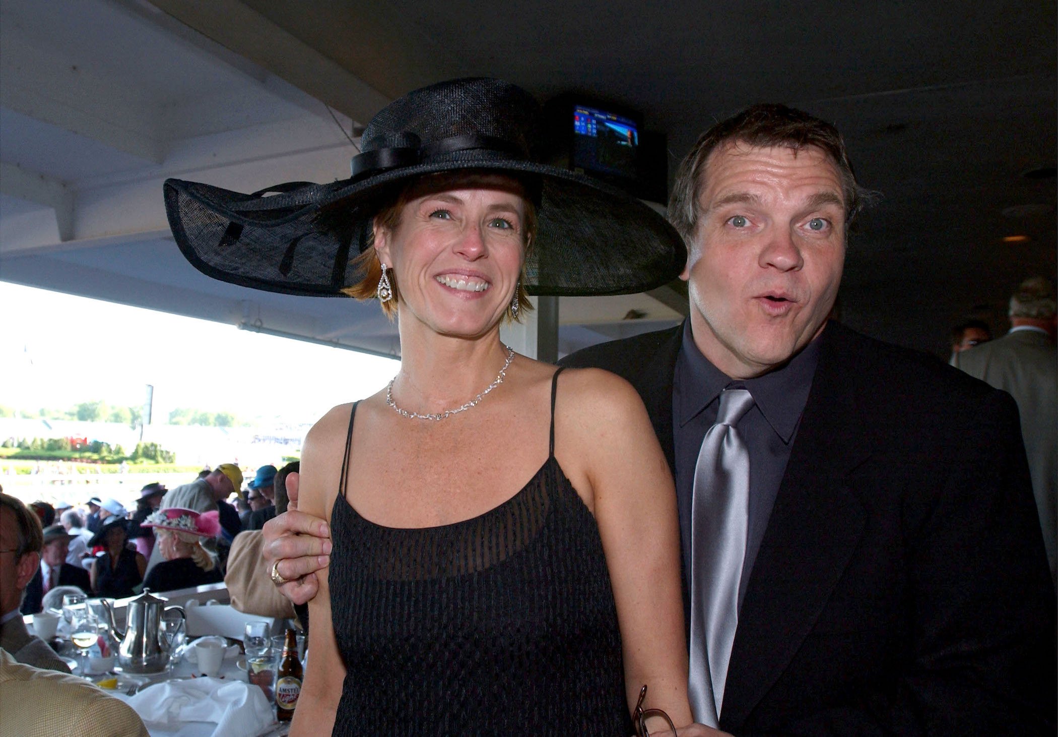 Meat Loaf and wife Deborah Gillespie standing together and smiling at an event
