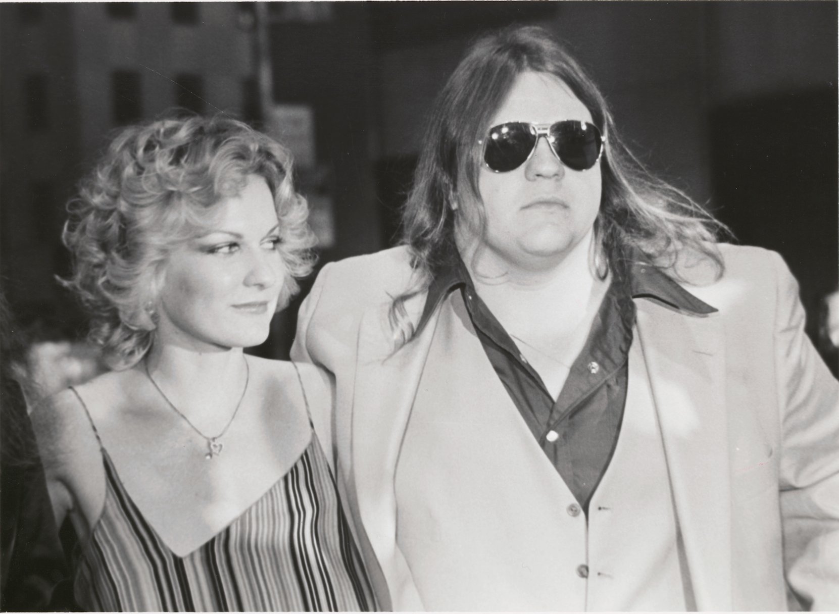 A black and white photo of Meat Loaf and his ex-wife, Leslie Aday