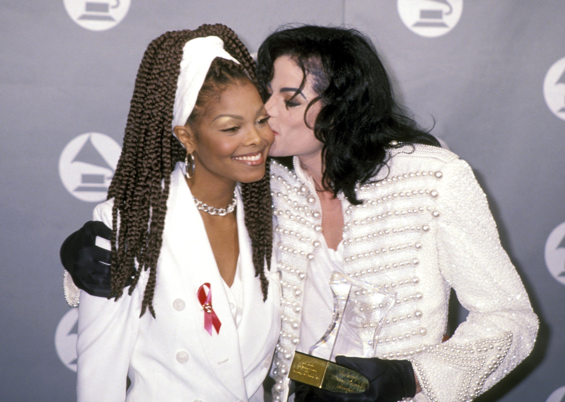 Michael Jackson kissing Janet Jackson on the cheek