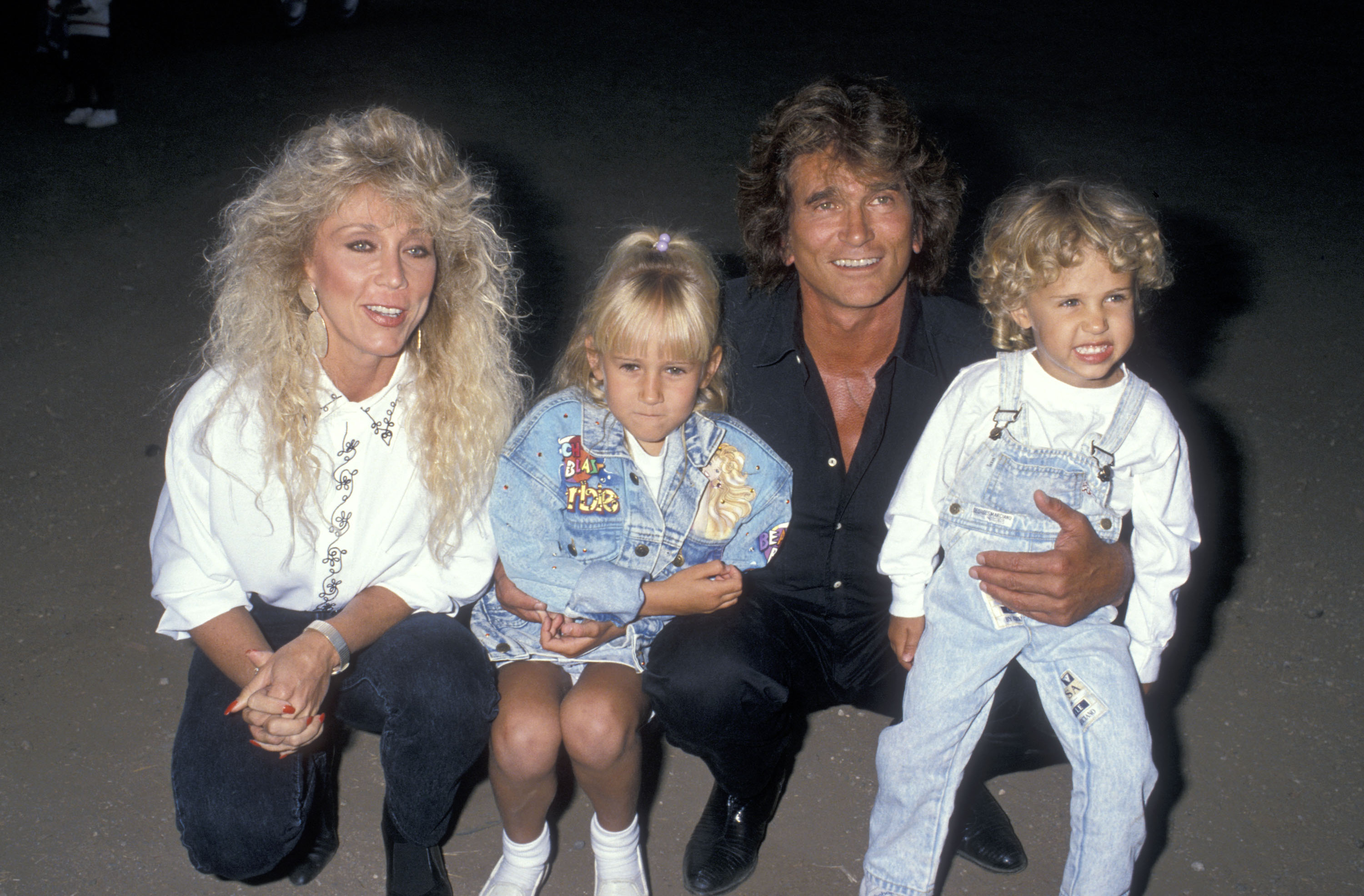 Michael Landon kneels with his wife, Cindy, and his children Jennifer and Sean