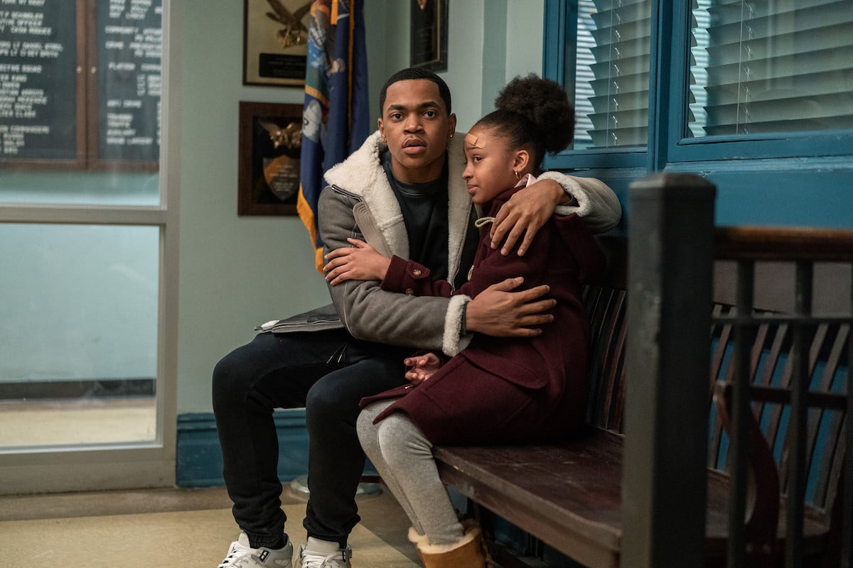 Michael Rainey Jr. as Tariq St. Patrick and Paris Morgan as Yasmine St. Patrick embracing while sitting in a police station in 'Power Book II: Ghost'