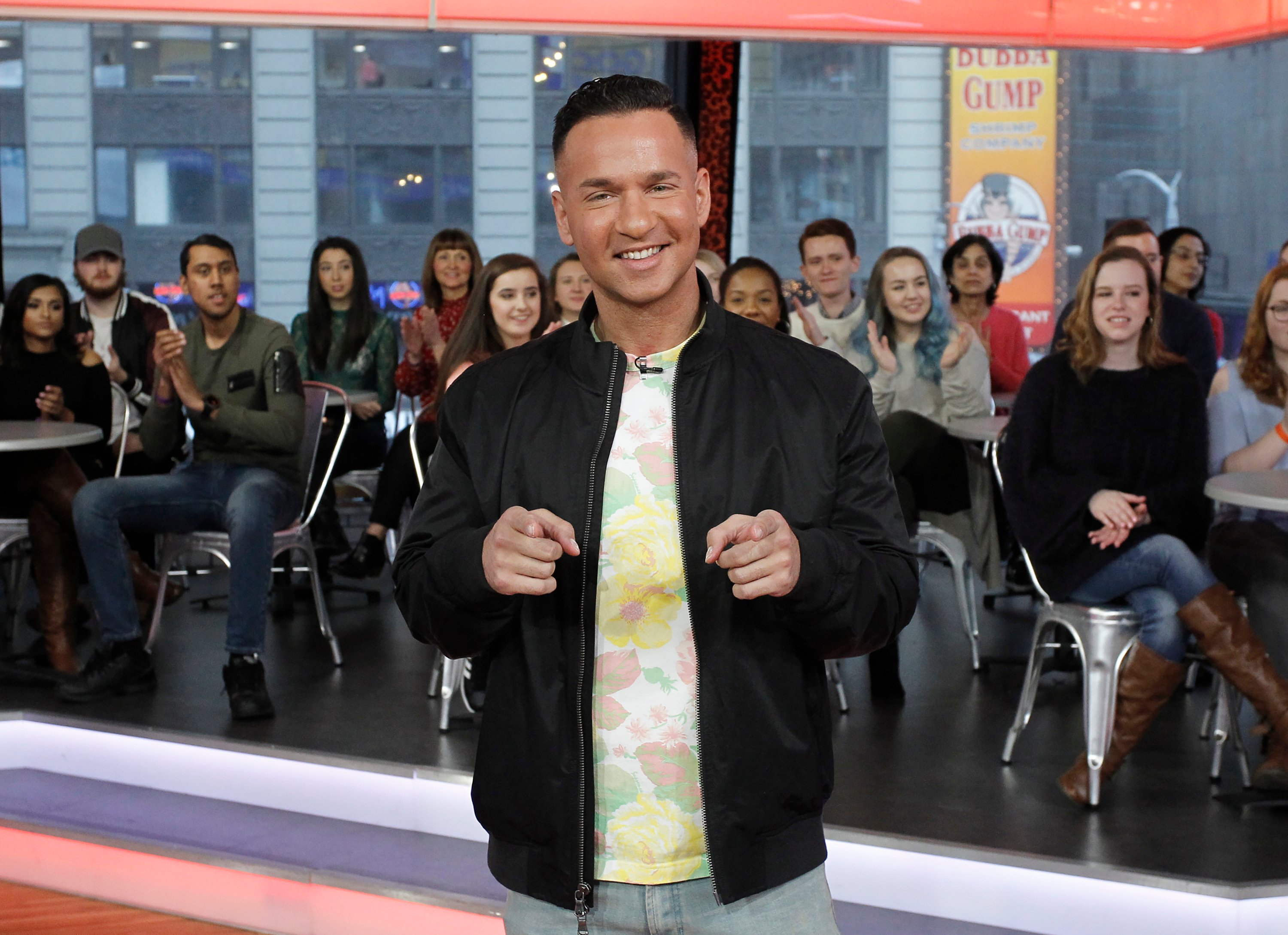 'Jersey Shore: Family Vacation' star Mike 'The Situation' Sorrentino, who waters his driveway, poses for a photo while pointing his fingers