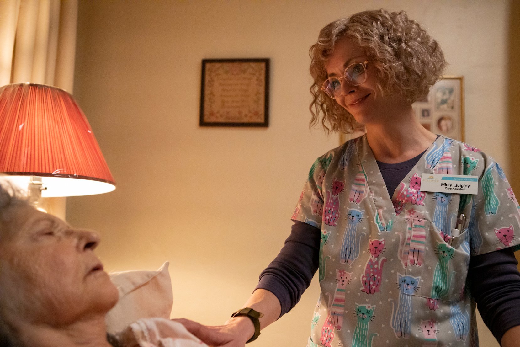 Misty in 'Yellowjackets' in a nurse uniform standing over a patient in a bed