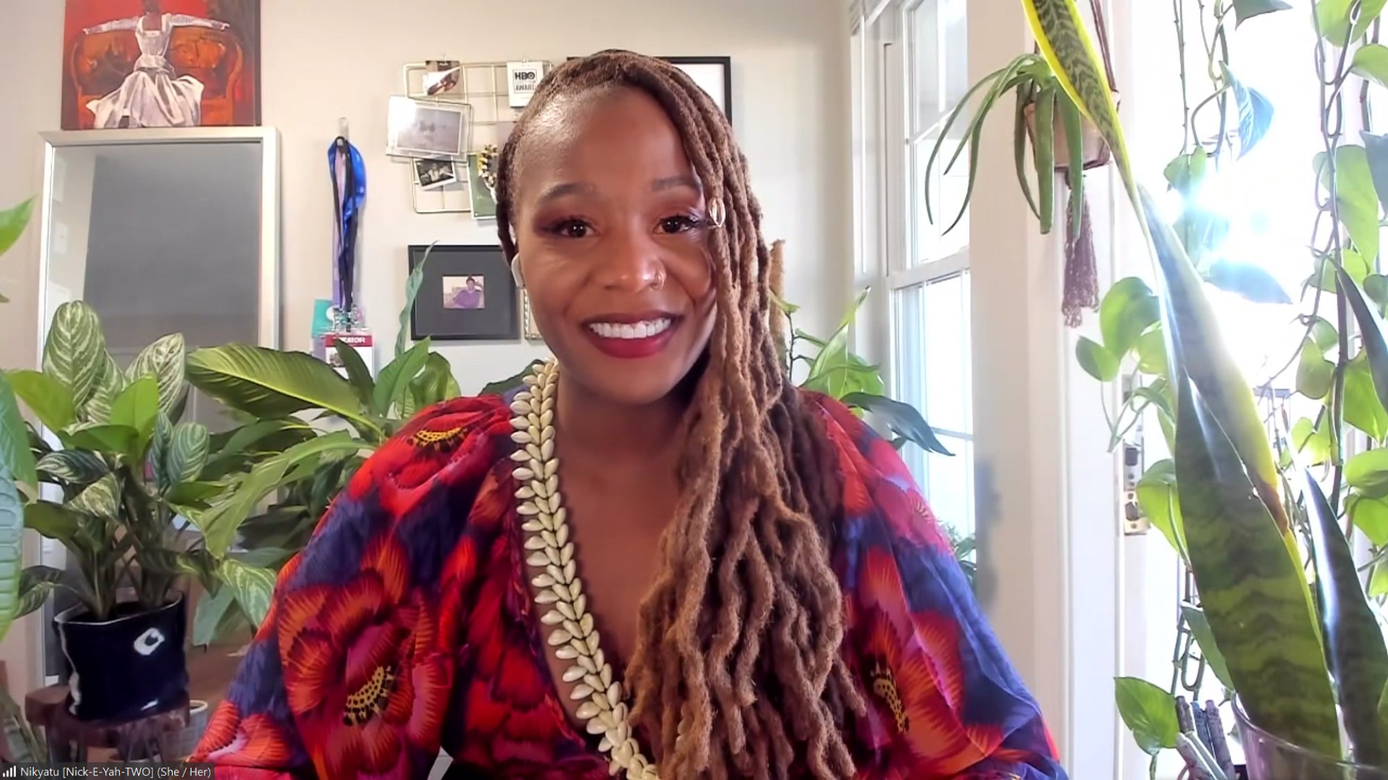 'Nanny' Nikyatu Jusu wearing red smiling