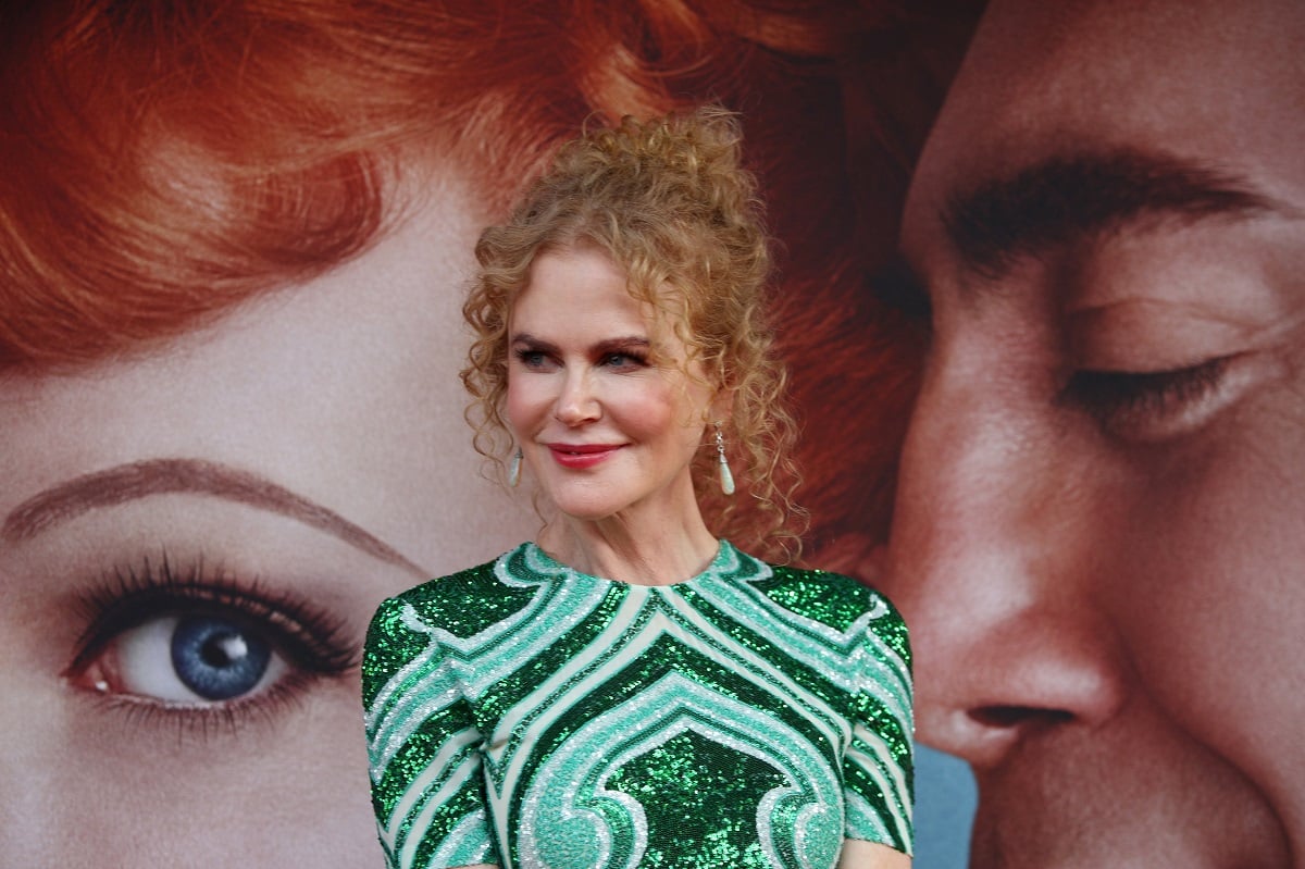 Nicole Kidman smiling in a green dress.