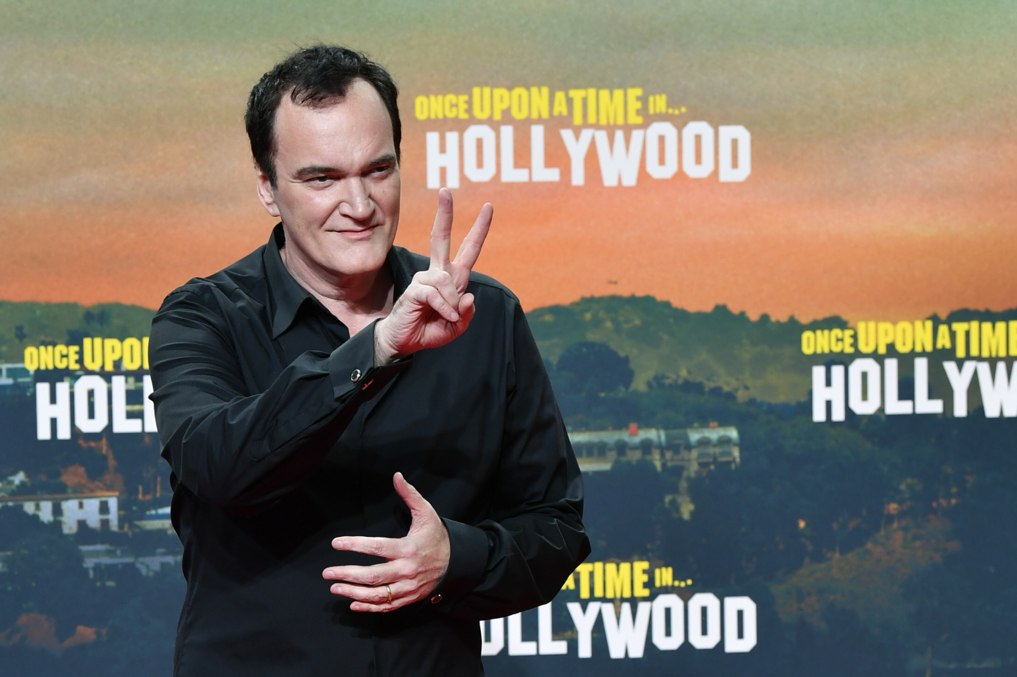 'Once Upon a Time in Hollywood' filmmaker Quentin Tarantino in article about beer holding up a peace sign