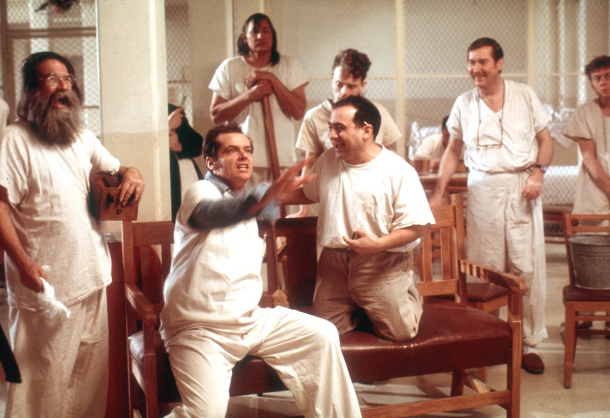 The cast of 'One Flew Over the Cuckoos Nest' films a scene in 1975